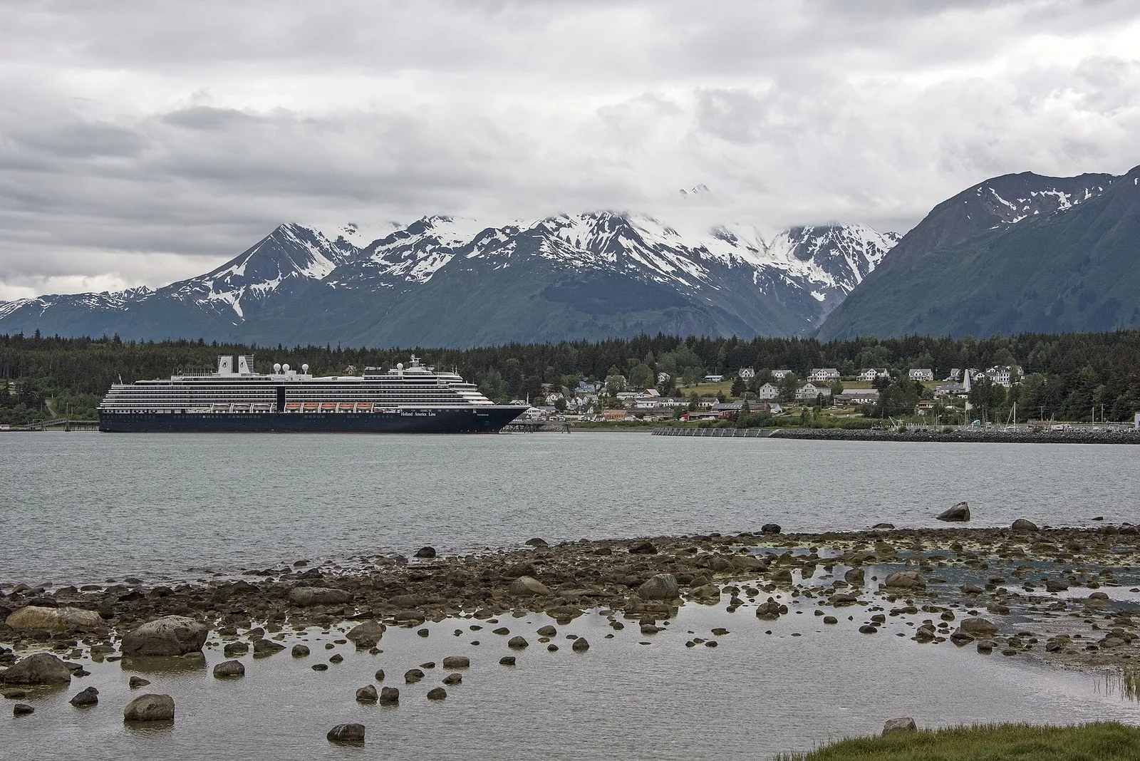 Cruise ship docked at Haines below snowy peaks, one of the smaller Alaska cruise ports