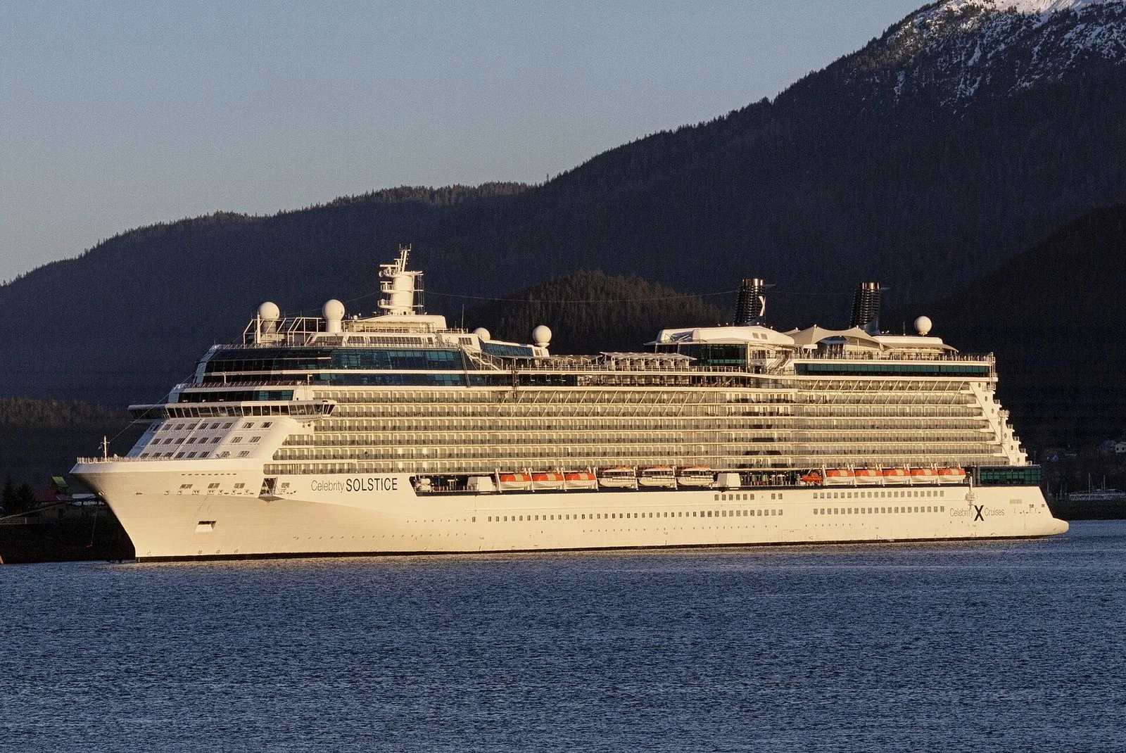 Rows of balcony cabins along the side of Celebrity Solstice at the AJ Dock in Juneau, the best cabin for an Alaska cruise for many travelers