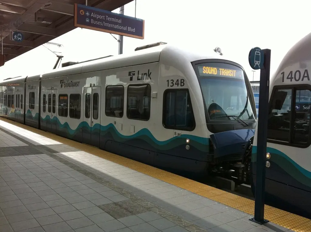 A Sound Transit Link light rail train waiting at the SeaTac Airport station platform