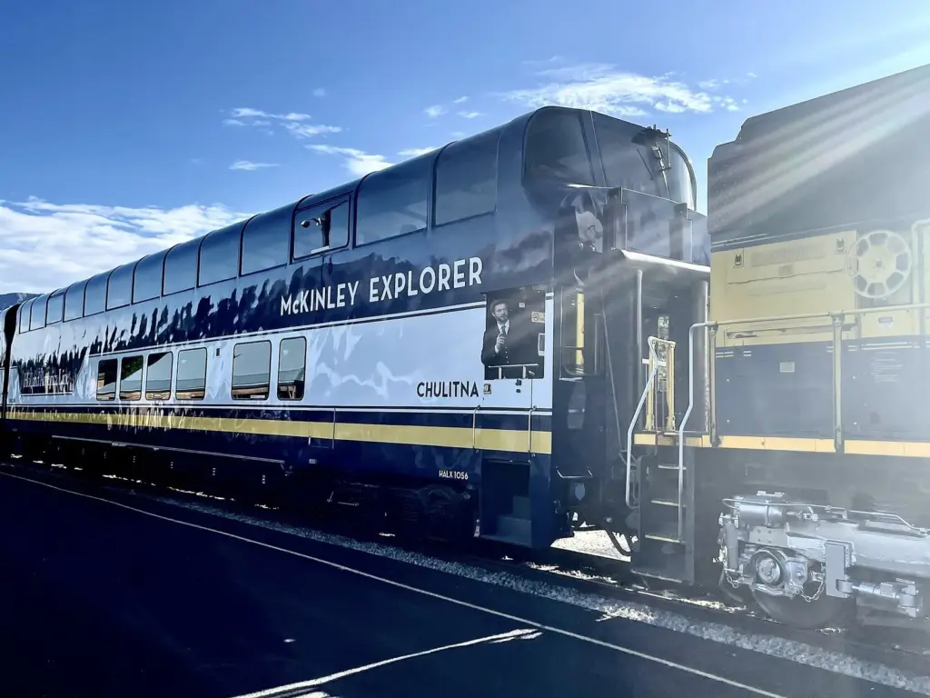 The blue and white double-deck McKinley Explorer dome railcar at the Denali National Park depot