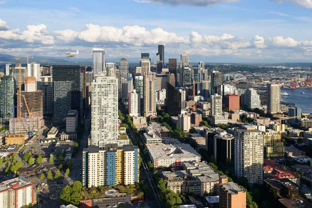 Downtown Seattle's towers and Elliott Bay seen from the Space Needle on a summer evening
