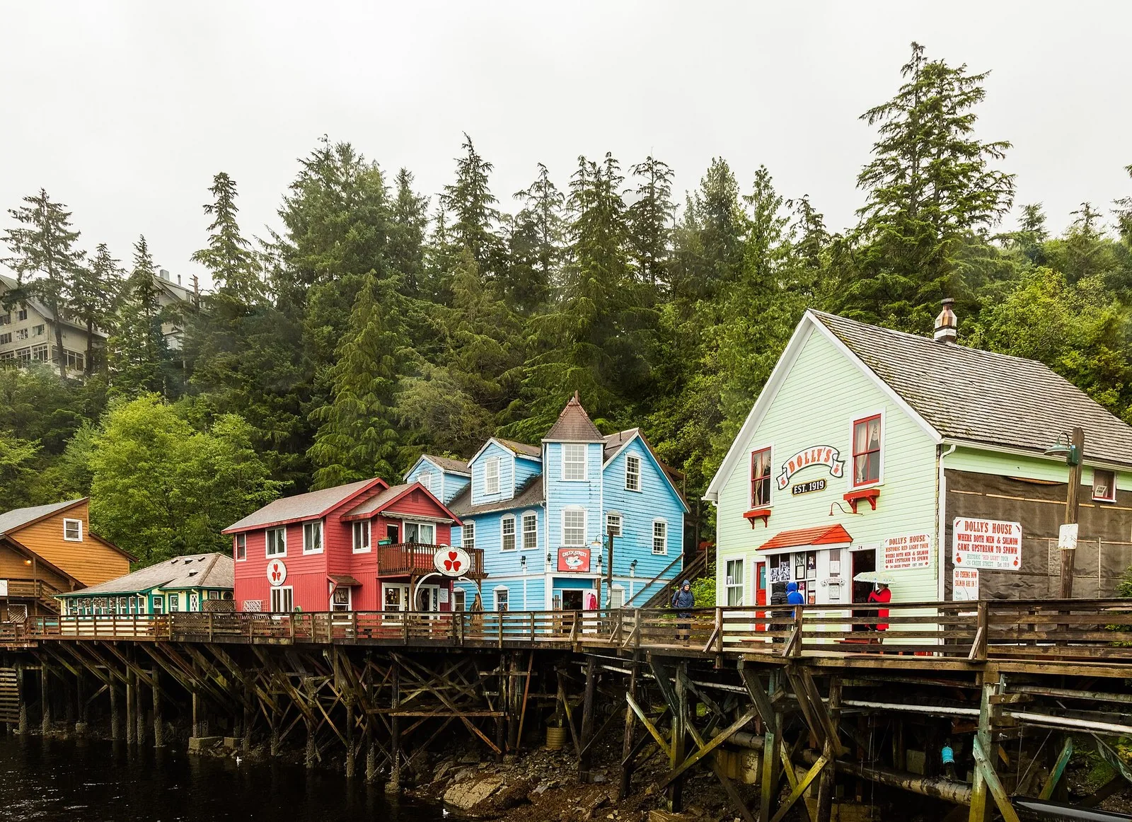 Colorful wooden houses on pilings along the boardwalk of Creek Street, the first stop on most lists of things to do in Ketchikan