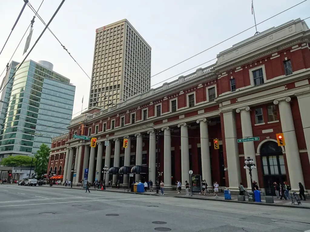 Red brick facade and columns of Waterfront Station on Cordova Street in downtown Vancouver